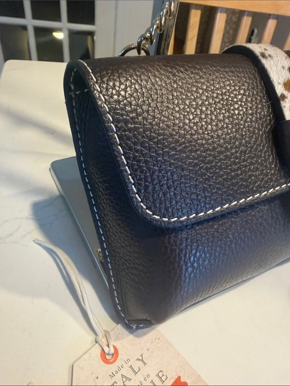 Black Pebbled Leather Crossbody Bag with Speckled Tab and Gold Chain